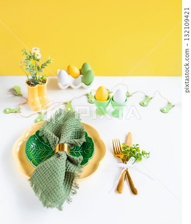 Easter celebration concept. Top view vertical green yellow plate eggs, isolated background, banner Easter celebration concept. Top view vertical green yellow plate eggs, isolated background, banner 132109421