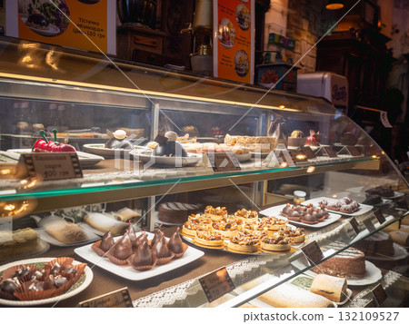[Ukraine] A wide variety of sweets lined up in a glass case at a cafe in Lviv, western Ukraine 132109527