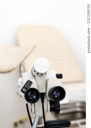 Colposcope, gynecology, medical device for detailed gynecological examination in a clinic room, offering copy space 132109530