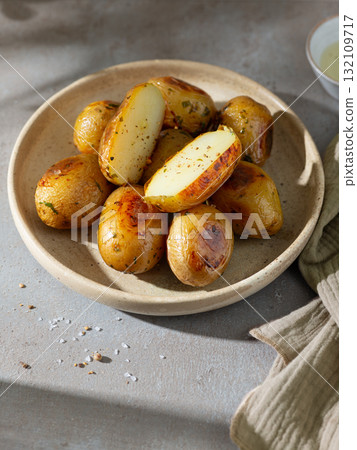 plate of roasted potatoes 132109717
