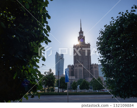[Poland] Palace of Culture and Science in the capital Warsaw, street trees and a clear evening sky 132109884