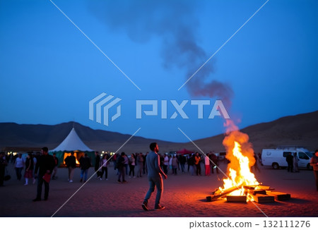 Bonfire Gathering in Desert Twilight. 132111276
