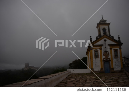 Church shrouded in fog Church shrouded in fog 132111286