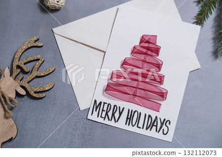 Christmas tree ribbon Gift Christmas idea. Do it yourself instruction postcard eco-friendly decoration. Making handmade presents children's diy projects. Holiday family time 132112073