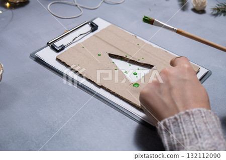 Christmas tree Storytelling of creating craft Christmas greeting card holiday present. Tactile hand-on activity. Master class progress of creative me-made gifts. Seasonal domestic life micro moment 132112090