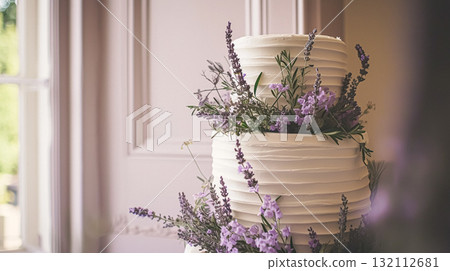Wedding cake with lavender flowers. Festive table decoration. 132112681