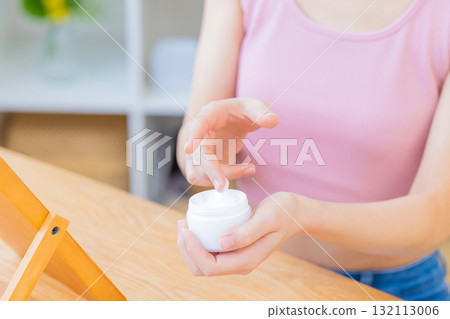 Beauty image: A woman's hand holding cosmetics Beauty image: A woman's hand holding cosmetics 132113006