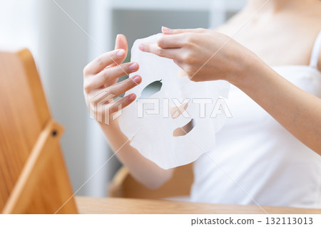 A woman's hand holding a face pack A woman's hand holding a face pack 132113013