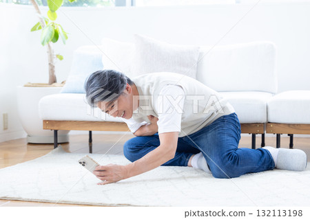 Middle-aged man suffering from chest pain Middle-aged man suffering from chest pain 132113198