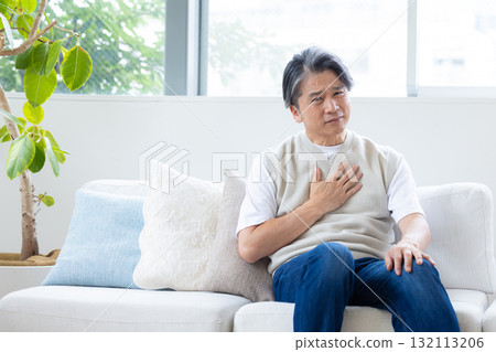 Middle-aged man suffering from chest pain 132113206