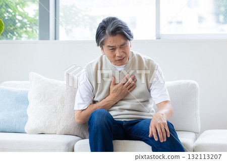 Middle-aged man suffering from chest pain Middle-aged man suffering from chest pain 132113207