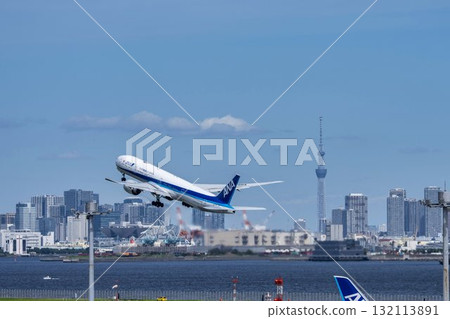 Scenery of Haneda Airport, plane taking off and Tokyo Skytree, Ota Ward, Tokyo 132113891