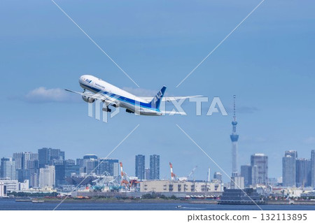 Scenery of Haneda Airport, plane taking off and Tokyo Skytree, Ota Ward, Tokyo 132113895