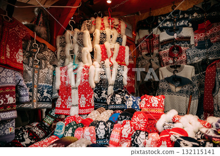 Traditional Christmas Winter Market Trading Houses With Warm Clothes, Wear And Hats. Colorful Knitted Traditional European Warm Clothes - Mittens and Scarfs. Xmas Souvenir From Europe. 132115141