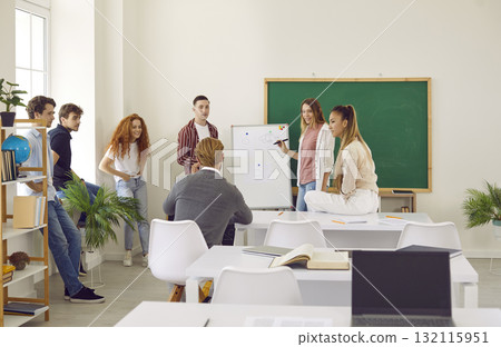 Students discussing study project with lecturer. Girl presenting project during class lesson Students discussing study project with lecturer. Girl presenting project during class lesson 132115951