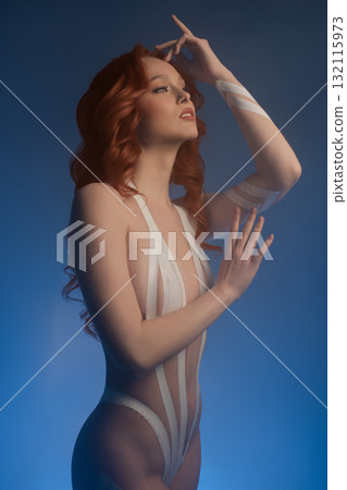 Beauty woman in studio showcasing body art with tape and fur elements 132115973