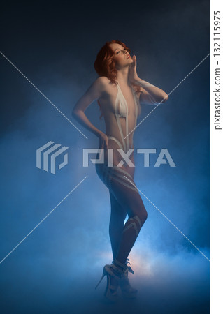 Body art featuring a woman with fur and tape in a creative studio setting Body art featuring a woman with fur and tape in a creative studio setting 132115975