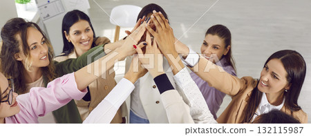 Group of cheerful young woman doing high five together 132115987