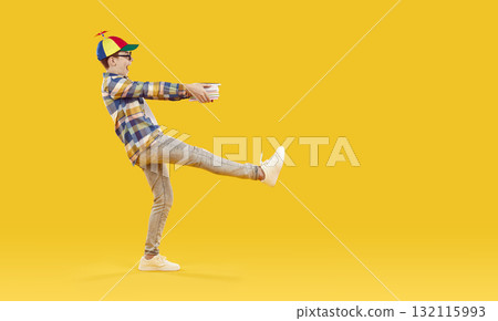 Side view portrait of cheerful schoolboy carrying textbooks Side view portrait of cheerful schoolboy carrying textbooks 132115993