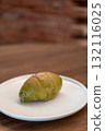 Green tea, Matcha Salted bread served on plate, on the wooden table 132116025