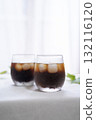 Iced coffee and houseplants on the windowsill 132116120