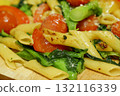 Italian-style dish of stir-fried tomatoes, komatsuna, and pasta 132116339