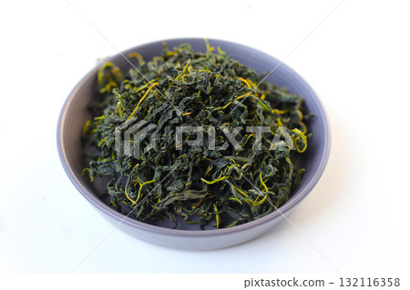 Dried mulberry leaves, commonly used for herbal tea and traditional remedies. Dried mulberry leaves, commonly used for herbal tea and traditional remedies. 132116358