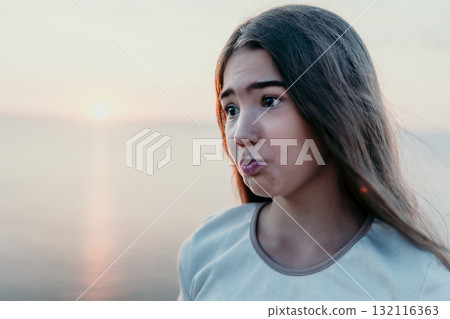 Portrait of a Young Girl at Sunset 132116363