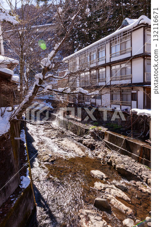 A hot spring inn with snow remaining A hot spring inn with snow remaining 132116671