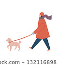 A woman in winter clothes walking a dog 132116898