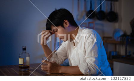 Focused gamer playing video game at night time 132117823