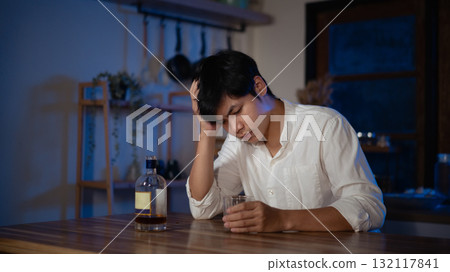 Focused gamer playing video game at night time Focused gamer playing video game at night time 132117841