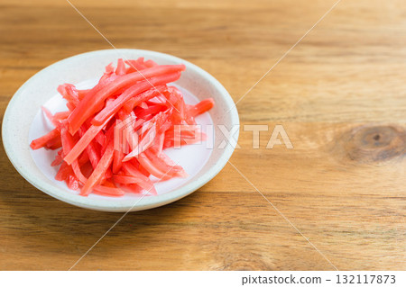 Pickled ginger placed on a wooden table 132117873