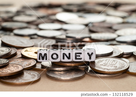 Scattered coins and MONEY alphabet beads 132118529