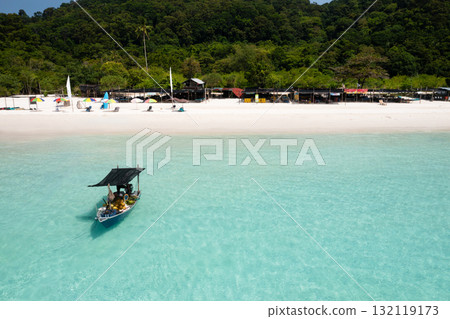 A coconut boat sits near a tropical beach on Redang Island in Malaysia. Turtle Beach A coconut boat sits near a tropical beach on Redang Island in Malaysia. Turtle Beach 132119173