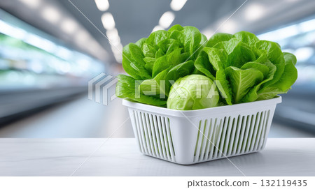 Fresh green lettuce and cabbage in plastic produce basket, vibrant eco friendly market produce and healthy salad option 132119435