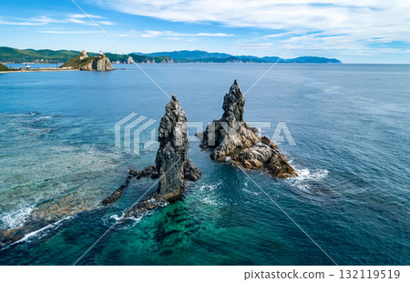 Stunning coastal landscape at sunrise with distinct rock formations and clear ocean waters Stunning coastal landscape at sunrise with distinct rock formations and clear ocean waters 132119519