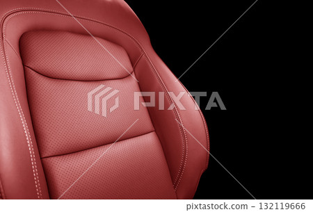 Car red leather interior. Part of red leather car seat details with white stitching. Interior of prestige car. Perforated leather seats isolated on black. Perforated leather. Car red leather interior. Part of red leather car seat details with white stitching. Interior of prestige car. Perforated leather seats isolated on black. Perforated leather. 132119666