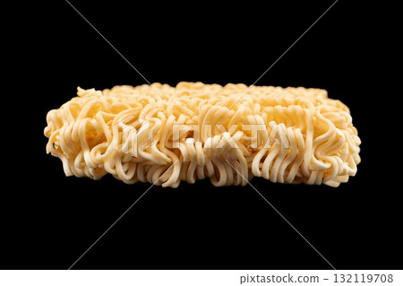Texture of dry instant noodles isolated on black background. Raw dried Instant ramen noodles block isolated. 132119708