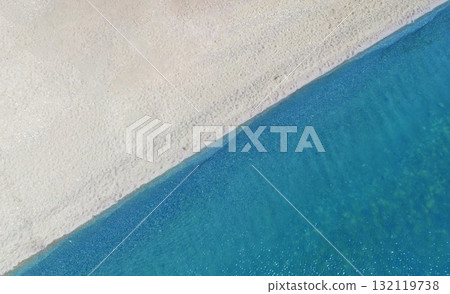 Aerial top view beach. Sand and ocean. Aerial view amazing empty white sand beach and turquoise clear water. Above Aerial top view beach. Sand and ocean. Aerial view amazing empty white sand beach and turquoise clear water. Above 132119738