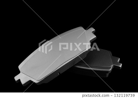 Brake pads isolated on black background. Auto parts. Brake pads isolated on black. Braking pads. Car part. Car detailing. Spare parts Brake pads isolated on black background. Auto parts. Brake pads isolated on black. Braking pads. Car part. Car detailing. Spare parts 132119739