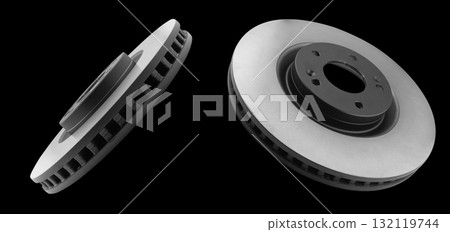 Car brake disc isolated on black background. Auto spare parts. Perforated brake disc rotor isolated on black. Braking ventilated discs. Quality spare parts for car service or maintenance. 132119744