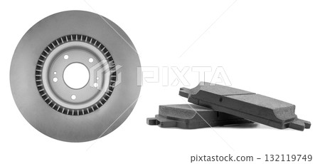 Car brake disc and brake pads isolated on white background. Auto spare parts. Perforated brake disc rotor isolated. Ventilated discs. Spare parts for car service or maintenance. Car brake disc and brake pads isolated on white background. Auto spare parts. Perforated brake disc rotor isolated. Ventilated discs. Spare parts for car service or maintenance. 132119749