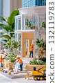 Miniature construction workers build a modern glass house model, symbolizing architectural development and teamwork. 132119783
