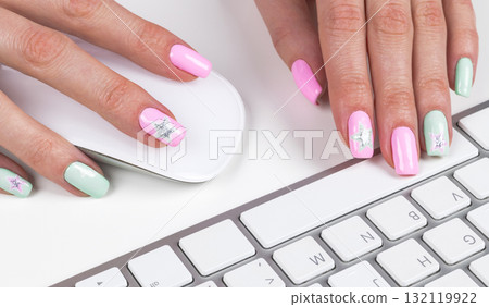 Closeup view of a business woman hands typing on wireless computer keyboard on office table. Soft lightning 132119922