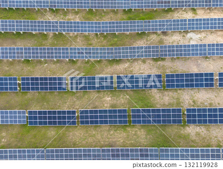 Aerial view of solar panels on a sunny day. Power farm producing clean energy. Solar panels on field. 132119928