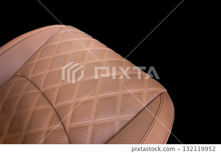 Luxury car  brown leather interior. Part of brown leather car seat details with stitching isolated on black. Interior of prestige car. Comfortable perforated leather seats. Perforated leather. 132119952