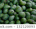 Close-up of green mangoes on sale at a fruit market in Southeast Asia 132120093