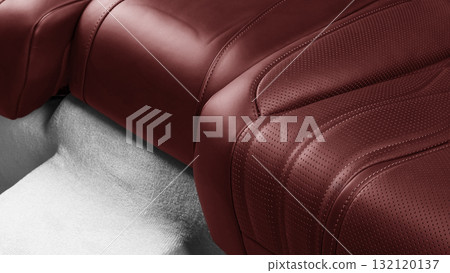 Car inside. Interior of prestige modern car. Comfortable leather seats. Red perforated leather. Back passenger seats. Car inside. Interior of prestige modern car. Comfortable leather seats. Red perforated leather. Back passenger seats. 132120137