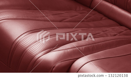 Car inside. Interior of prestige modern car. Comfortable leather seats. Red perforated leather. Back passenger seats. Car inside. Interior of prestige modern car. Comfortable leather seats. Red perforated leather. Back passenger seats. 132120138
